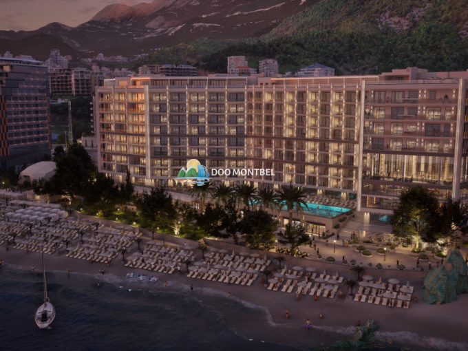 Современный курортный отель у пляжа на закате